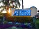 Snead Island community entrance sign with a blue heron statue surrounded by colorful plants at 4517 Pinfish Ln, Palmetto, FL 34221