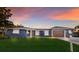 Well-kept home with a lush lawn, a two-car garage, and elegant shutters adding curb appeal at 4517 Pinfish Ln, Palmetto, FL 34221