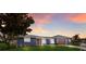 Charming single-story home with a well-maintained lawn, stylish shutters, and a two-car garage at 4517 Pinfish Ln, Palmetto, FL 34221