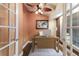 Bright home office space with a ceiling fan, desk, and lots of natural light at 4517 Pinfish Ln, Palmetto, FL 34221