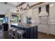 Open kitchen featuring a large island with bar seating, modern lighting and stainless appliances at 4517 Pinfish Ln, Palmetto, FL 34221