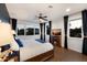 Cozy main bedroom features large windows, a fireplace, and tasteful furnishings creating a relaxing atmosphere at 4517 Pinfish Ln, Palmetto, FL 34221
