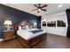 Spacious main bedroom featuring a wood-look floors, large window, and elegant furnishings at 4517 Pinfish Ln, Palmetto, FL 34221