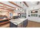Open concept living area showing seamless flow between dining, kitchen and living spaces at 4517 Pinfish Ln, Palmetto, FL 34221