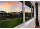 Beautiful water view seen from the window, with lush green grass and calm water at 4517 Pinfish Ln, Palmetto, FL 34221