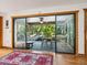 A view from the living room to the screened-in patio, offering an extended relaxing living space at 4917 Hidden Oaks Trl, Sarasota, FL 34232