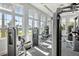 Well-equipped gym with an array of modern machines and large windows offering plenty of natural light at 4929 Seafoam Trl, Bradenton, FL 34211