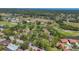 Aerial view of a community with lush landscaping, mature trees, and golf course at 4947 Greencroft Rd # 175, Sarasota, FL 34235
