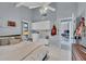 Spacious bedroom with a vaulted ceiling, built-in storage, and a view into a home office at 4947 Greencroft Rd # 175, Sarasota, FL 34235