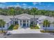 Striking exterior of community building with manicured landscaping and ample parking at 4947 Greencroft Rd # 175, Sarasota, FL 34235