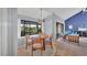 Cozy dining area next to a large living room featuring tile flooring and plenty of natural light at 4947 Greencroft Rd # 175, Sarasota, FL 34235