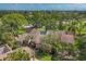 The exterior of this home boasts mature trees and lush landscaping, nestled within a serene community at 4947 Greencroft Rd # 175, Sarasota, FL 34235
