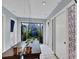 Bright foyer with tile floors, skylight, and view of interior courtyard at 4947 Greencroft Rd # 175, Sarasota, FL 34235