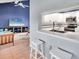 Open concept kitchen with updated appliances and a breakfast bar at 4947 Greencroft Rd # 175, Sarasota, FL 34235