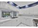 Bright kitchen with white cabinetry and stainless steel appliances, offering a seamless cooking experience at 4947 Greencroft Rd # 175, Sarasota, FL 34235