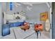 Spacious living room with a bar, wine cooler and access to the lanai at 4947 Greencroft Rd # 175, Sarasota, FL 34235