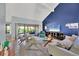 Comfortable living room with vaulted ceiling, large windows, and stylish furnishings at 4947 Greencroft Rd # 175, Sarasota, FL 34235