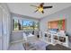 Bright office with a large window, stylish decor, and an exterior view at 4947 Greencroft Rd # 175, Sarasota, FL 34235