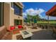 Inviting outdoor deck with comfortable seating, fire feature, and views of the golf course at 4947 Greencroft Rd # 175, Sarasota, FL 34235