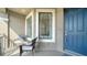 Cozy front porch with seating provides a welcoming entrance to this lovely home at 5424 Cicerone St # 204, Sarasota, FL 34238