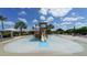 Community splash pad with various water features and play structures, perfect for a day of Gathering fun and outdoor entertainment at 5424 Cicerone St # 204, Sarasota, FL 34238