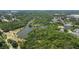 Beautiful aerial view of the neighborhood with mature trees, water features, and homesites available at 5504 Beneva Woods Circle, Sarasota, FL 34233