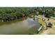Overhead view of the local park with picnic pavilion, walking path and mature trees at 5504 Beneva Woods Circle, Sarasota, FL 34233