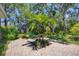 Enjoy the paver patio, lush landscaping, and private putting green in this beautiful and serene backyard at 5504 Beneva Woods Circle, Sarasota, FL 34233