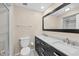 Modern bathroom with dual sink vanity, sleek hardware, and tiled walk-in shower at 5504 Beneva Woods Circle, Sarasota, FL 34233