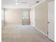 Bright bedroom featuring neutral carpet, ceiling fan, and a window with natural light at 5504 Beneva Woods Circle, Sarasota, FL 34233