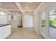 Bright and airy dining room with coffered ceilings and sliding glass doors to a screened patio at 5504 Beneva Woods Circle, Sarasota, FL 34233
