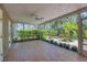 Spacious screened-in lanai overlooking a lush, landscaped backyard, offering serene outdoor living at 5504 Beneva Woods Circle, Sarasota, FL 34233