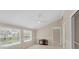 Open floor plan living room features lots of light, neutral colors, chair rail and a ceiling fan at 5504 Beneva Woods Circle, Sarasota, FL 34233