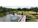 A walking path hugs the water in the local community park with benches and a picnic pavilion at 5504 Beneva Woods Circle, Sarasota, FL 34233