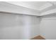 Walk-in closet with rod shelf and carpet flooring for organized storage solutions at 5504 Beneva Woods Circle, Sarasota, FL 34233