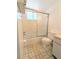 Bathroom featuring a tiled shower with glass doors at 5901 Garden Ln # H23, Bradenton, FL 34207