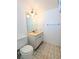 Bathroom featuring a modern mirror, lighting and fixtures at 5901 Garden Ln # H23, Bradenton, FL 34207