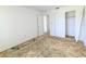 Bright bedroom featuring a standard closet and entry to another room at 5901 Garden Ln # H23, Bradenton, FL 34207