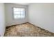 Bedroom showcasing a window with bright natural light at 5901 Garden Ln # H23, Bradenton, FL 34207