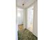 Hallway leading to a bathroom and laundry room at 5901 Garden Ln # H23, Bradenton, FL 34207