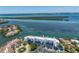 Aerial view of condo complex with waterfront access and beautiful ocean view at 615 Dream Island Pl # 303, Longboat Key, FL 34228