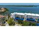 Coastal complex: Aerial view showing the building and parking areas along the waterfront at 615 Dream Island Pl # 303, Longboat Key, FL 34228
