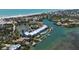 Aerial view of waterfront condo with a pool, boat slips and convenient beach access at 615 Dream Island Pl # 303, Longboat Key, FL 34228