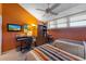 Comfortable bedroom featuring two beds, desk, and soft natural light at 615 Dream Island Pl # 303, Longboat Key, FL 34228