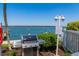 Stainless steel gas grill near the ocean, next to posted rules at 615 Dream Island Pl # 303, Longboat Key, FL 34228