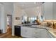 Updated kitchen with granite counters and stainless sink with great views to the living space at 615 Dream Island Pl # 303, Longboat Key, FL 34228
