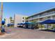 Ample parking: covered parking adjacent to the buildings, with tropical landscaping at 615 Dream Island Pl # 303, Longboat Key, FL 34228