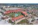 Beautiful aerial view of condominiums next to the beach with community pool and outdoor gazebo at 6236 Midnight Pass Rd # 300, Sarasota, FL 34242