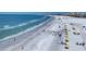 Enjoy the beautiful beach with clear water, white sand, and comfortable seating, ideal for relaxation and sunbathing at 6236 Midnight Pass Rd # 300, Sarasota, FL 34242