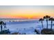 Beautiful sunset over the Gulf of Mexico, with silhouettes of people on the beach at 6236 Midnight Pass Rd # 300, Sarasota, FL 34242